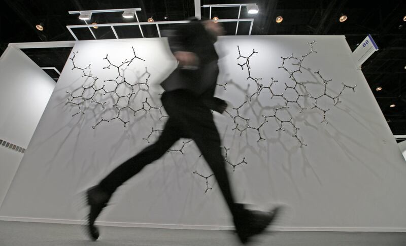 epa06617847 A man passes close to at the artwork 'Waterbones' by Italian artist Loris Cecchini during the 12th annual Art Dubai exhibition at Madinat Jumeirah, Dubai, United Arab Emirates, 21 March 2018.  EPA/ALI HAIDER