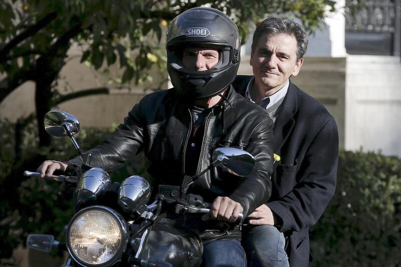 Economy of travel, Greek style. The country's finance minister Yanis Varoufakis (front) and deputy minister for international economic relations Euclid Tsakalotos leave the Maximos Mansion after a meeting with Prime Minister Alexis Tsipras in Athens April 3, 2015.  Alkis Konstantinidis / Reuters