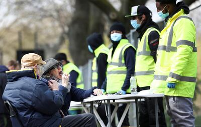 People swab themselves for coronavirus disease (COVID-19) at a testing site on Clapham Common in London, Britain, April 16, 2021. REUTERS/Henry Nicholls