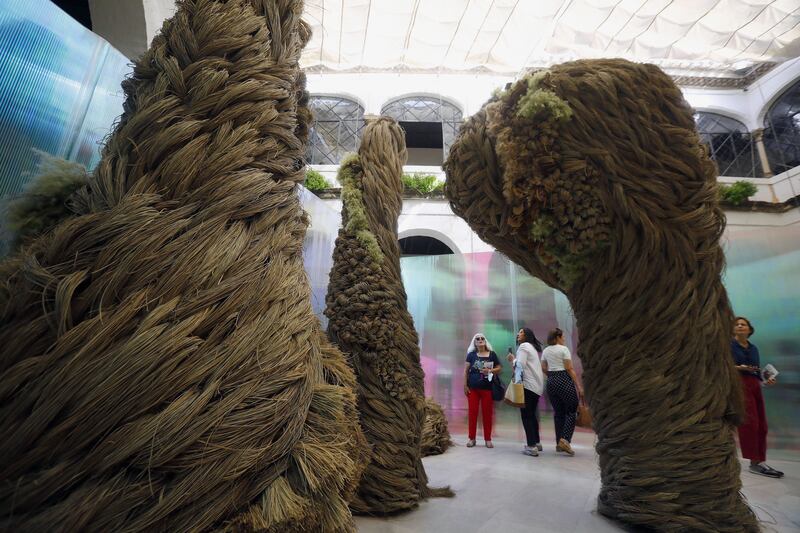 People look at Kokon's 'Ovidio' installation by Mari Eugenia de Diego, dislayed as part of the International Flower Festival 'Flora 2022', showing avant-garde creations with natural flowers in Cordoba, Spain. The installation won first prize at the festival.   EPA 