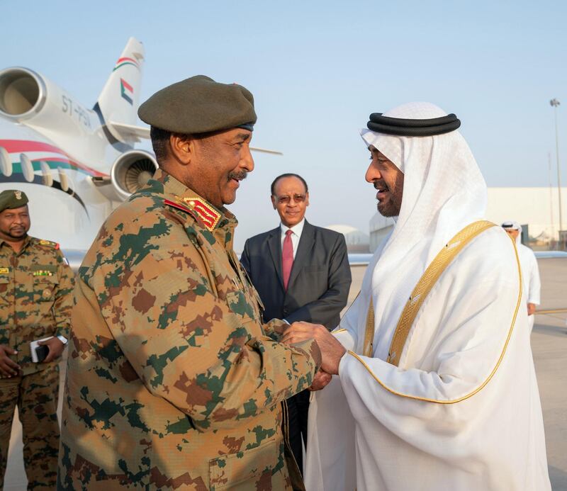 ABU DHABI, UNITED ARAB EMIRATES - May 26, 2019: HH Sheikh Mohamed bin Zayed Al Nahyan, Crown Prince of Abu Dhabi and Deputy Supreme Commander of the UAE Armed Forces (R) receives Lieutenant General Abdel Fattah Al Burhan Abdelrahman, Head of transitional military council of Sudan (L), at the Presidential Airport.
( Mohamed Al Hammadi / Ministry of Presidential Affairs )
---