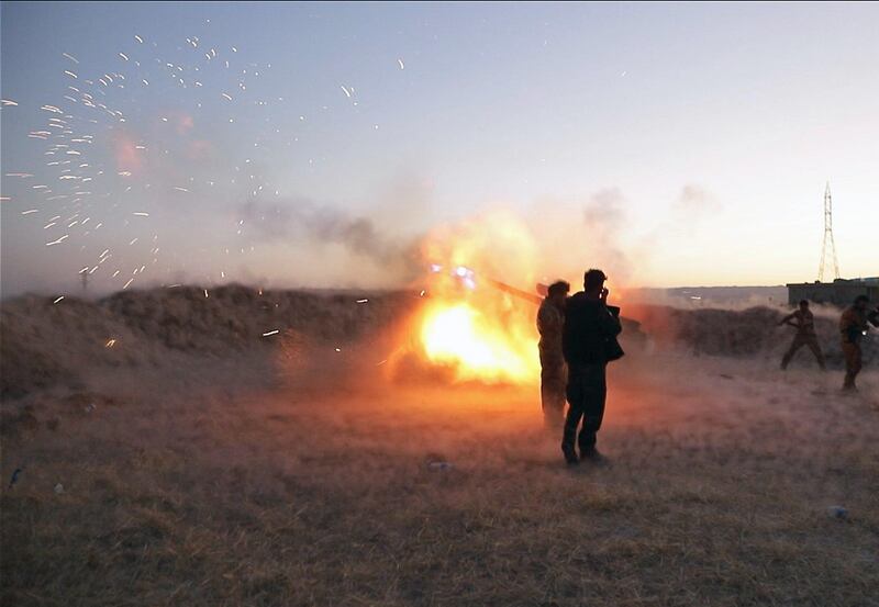 Peshmerga fighters fire an from their position near the Altun Kubri checkpoint, 40kms from Kirkuk, on October 20, 2017.
Iraqi forces clashed with Kurdish fighters as the central government said it wrestled back control of the last area of disputed Kirkuk province in the latest stage of a lightning operation following a controversial independence vote. / AFP PHOTO / Marc-Antoine Pelaez