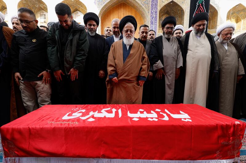 Prayers over the coffin of senior IRGC adviser Brig Gen Razi Mousavi  in Iraq before his body is returned to Iran. Reuters