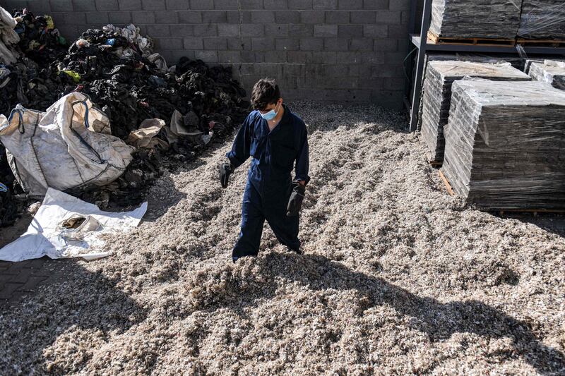At the factory near Cairo, mounds of plastic are funnelled into machines, shredded and liquefied before emerging as compact bricks
