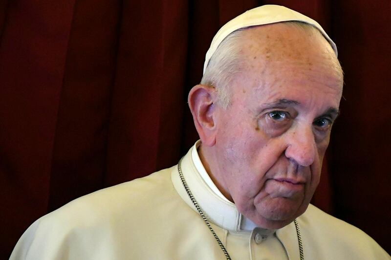 Pope Francis listens to a reporter's question on board the flight back to Rome from a two-day trip to Morocco, Sunday, March 31, 2019.  Francis sought Sunday to encourage greater fraternity between Christians and Muslims in Morocco, telling his flock that showing the country's Muslim majority they are part of the same human family will help stamp out extremism. (Alberto Pizzoli/Pool Photo via AP)