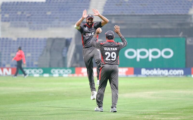 Abu Dhabi, United Arab Emirates, October 27, 2019.  
T20 UAE v Canada-AUH-
-- (R-L) Rameez Shahzad gives a jumping high five to Sultan Ahmad during their match against Canada.
Victor Besa/The National
Section:  SP
Reporter:  Paul Radley
