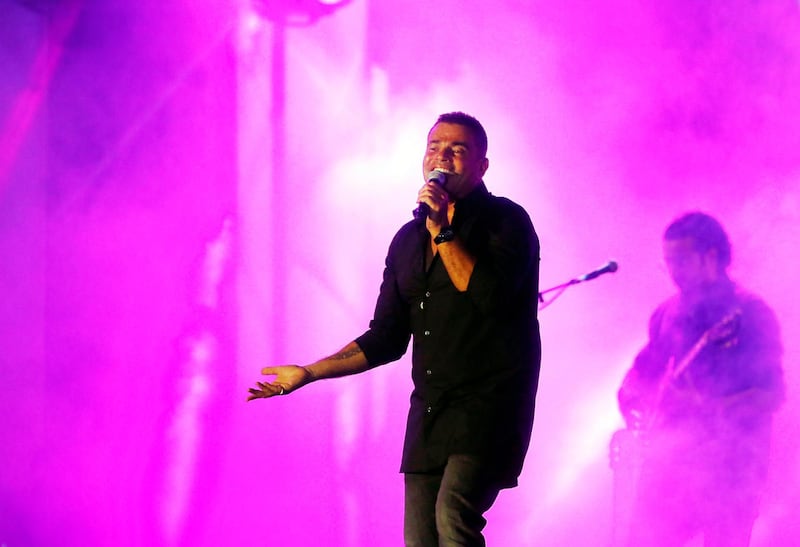 Egyptian pop star Amr Diab performs at the newly built Jeddah Superdome, in Jeddah, Saudi Arabia on June 18, 2021. The concert is organised by the Saudi General Entertainment Authority after the kingdom lifted coronavirus restrictions on events in May. AP Photo