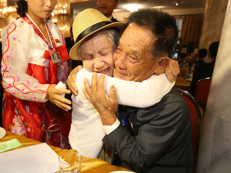 Lee Gyum-sum, 92, of South Korea, left, meets her North Korean son Lee Sung-chul, 71, during the inter-Korean family reunions at the Mount Kumgang resort, North Korea. EPA