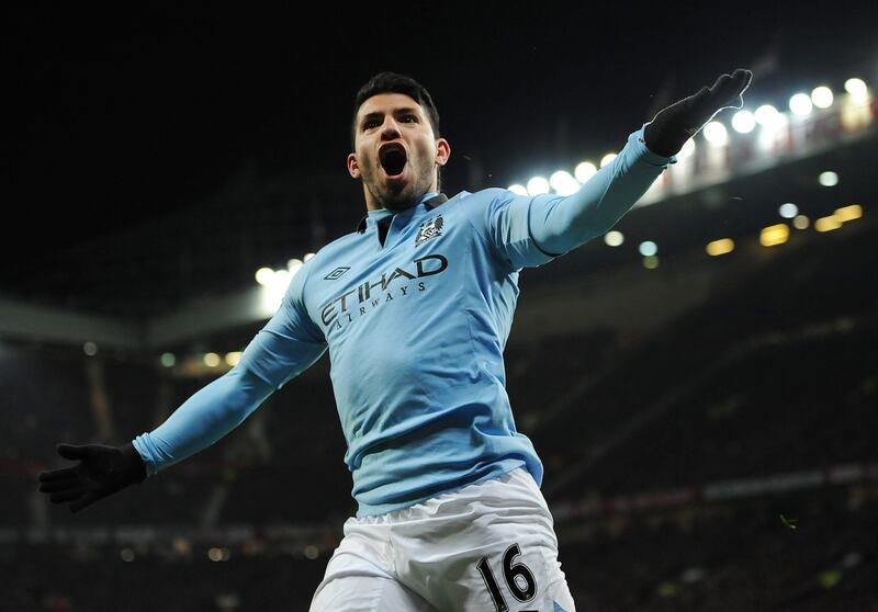 epa03654531 Manchester City's Sergio Aguero (C) celebrates after scoring the winning goal during the English Premier League soccer match between Manchester United and Manchester City at Old Trafford, Manchester, Britain, 08 April 2013. City won the match 2-1.  EPA/PETER POWELL DataCo terms and conditions apply.  https://www.epa.eu/downloads/DataCo-TCs.pdf *** Local Caption ***  03654531.jpg