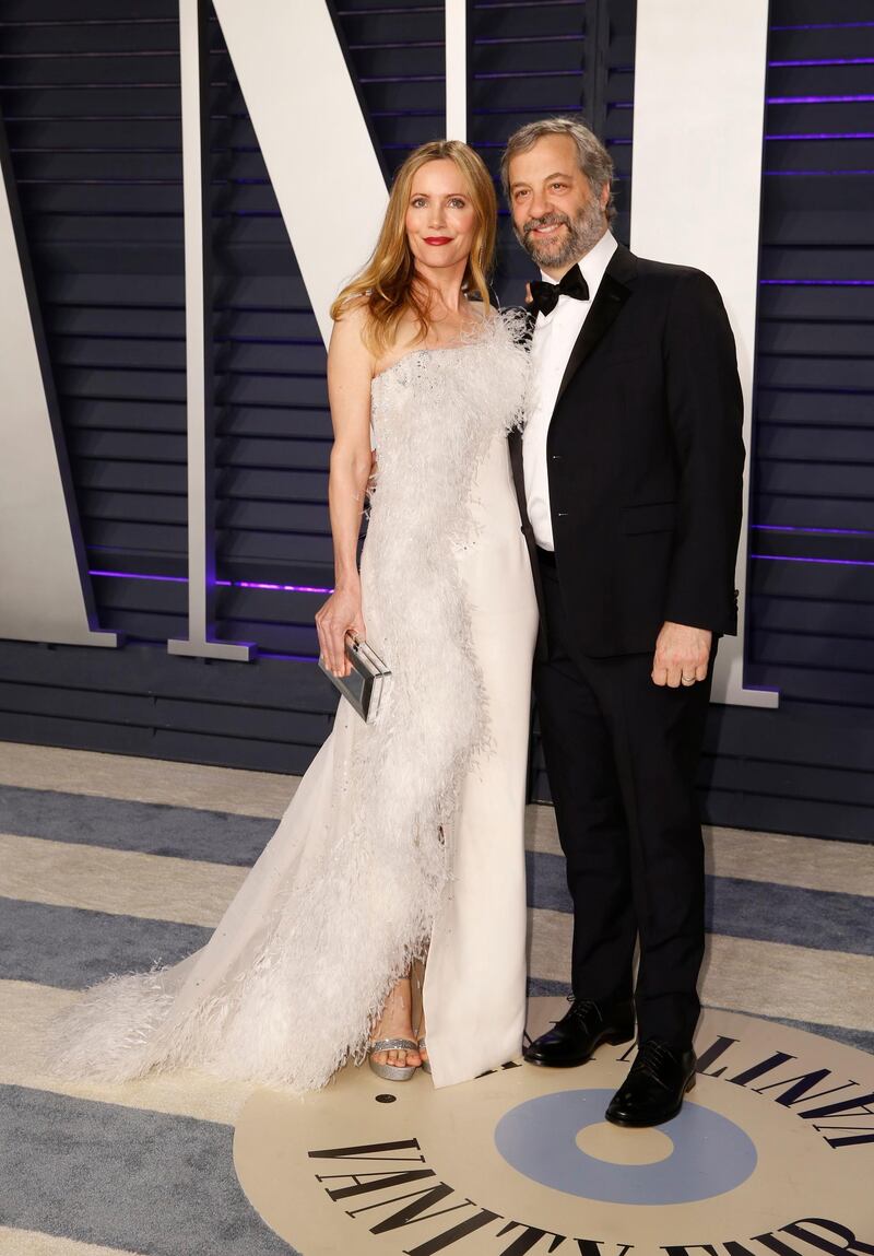 Leslie Mann in Ralph & Russo and Judd Apatow arrive at the 2019 Vanity Fair Oscar Party. Reuters