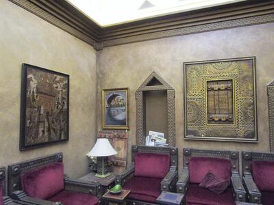 Ali Al Ruzaiza’s majlis, containing his paintings as well as charismatic and window frames that he has carved. Courtesy Myrna Ayad                        