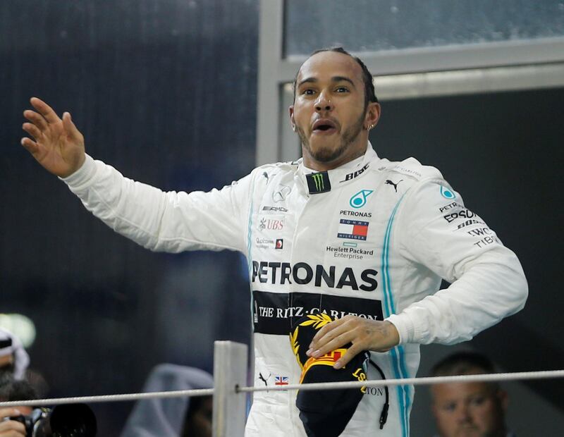 Lewis Hamilton celebrates after winning the race. Reuters