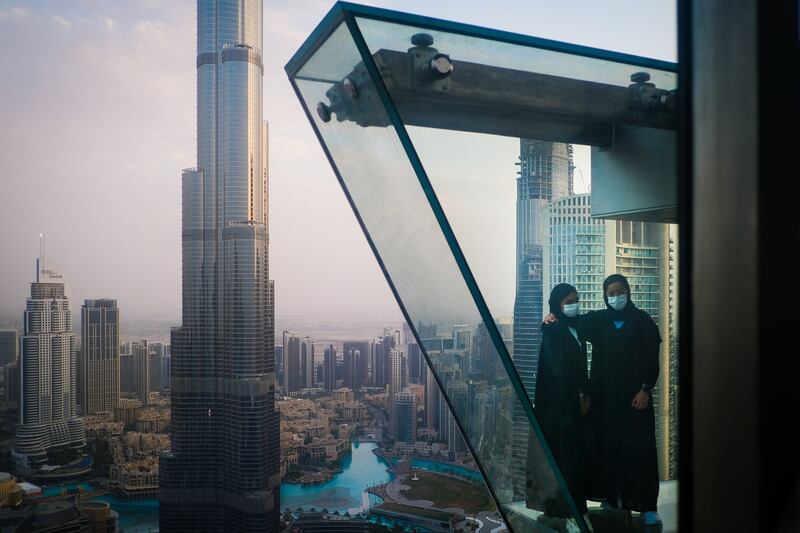 Posing for a photo in front of the Burj Khalifa. EPA