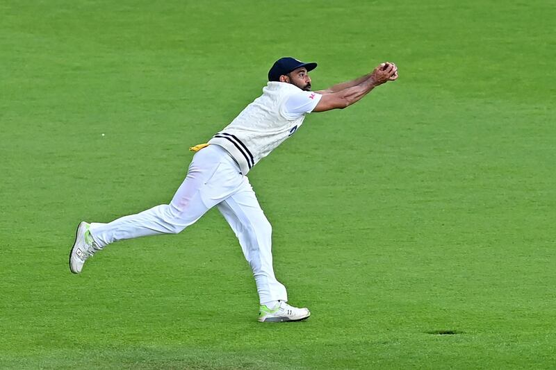 India fielder Mohammed Shami takes a catch to dismiss New Zealand's Devon Conway for 54. AFP