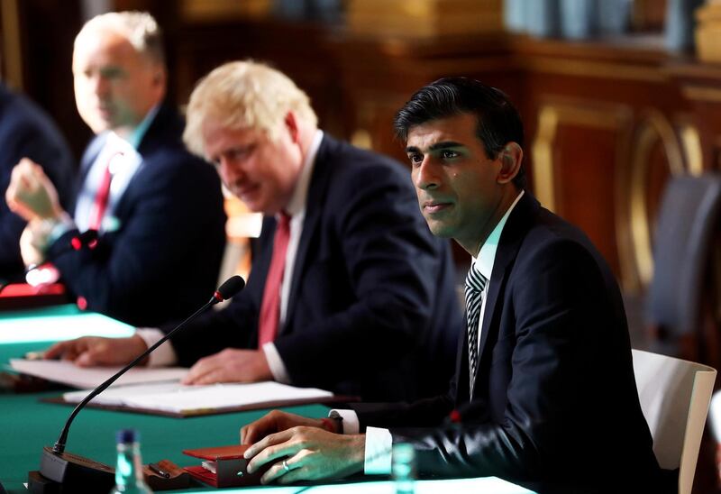 FILE PHOTO: Britain's Chancellor of the Exchequer Rishi Sunak attends a face-to-face meeting of the cabinet team of ministers, the first since mid-March because of the coronavirus disease (COVID-19) pandemic, at the Foreign and Commonwealth Office (FCO) in London, Britain, July 21, 2020. REUTERS/Simon Dawson/Pool/File Photo