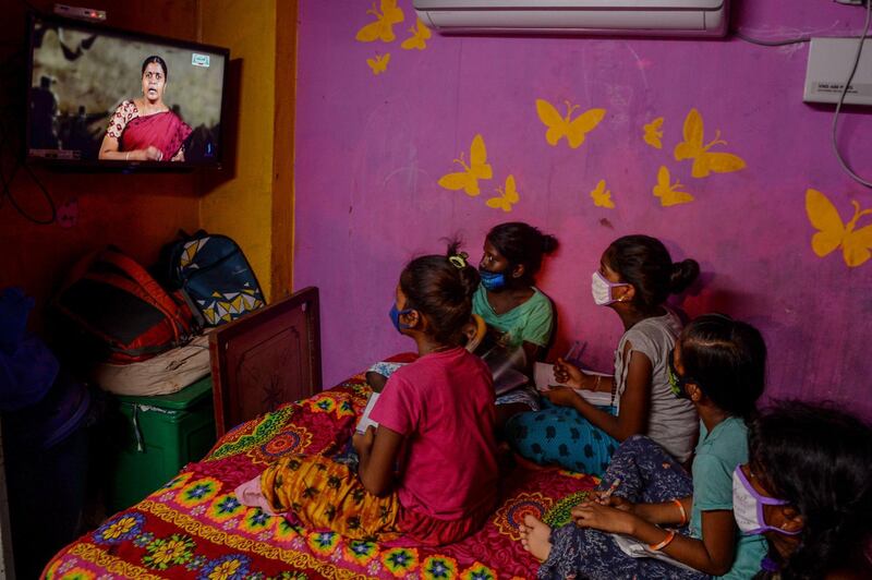 Children attend a tele-learning class at their home displayed on Kalvi TV channel, an education tele-learning initiative set up by the department of school education, amid the coronavirus pandemic in India's southern city of Chennai. AFP