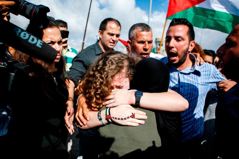 Ahed Tamimi embraces a woman upon her release. AFP
