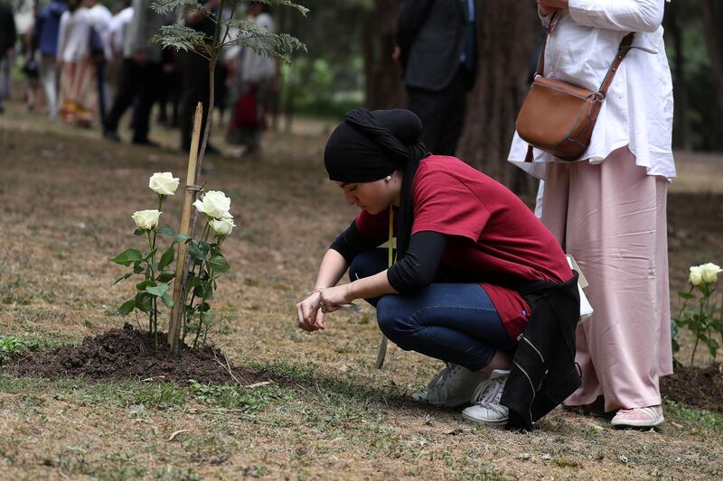 A family member reacts after laying a flower during a memorial ceremony for the victims of the Ethiopian Airlines Flight ET302 plane crash, at the French Embassy in Addis Ababa, Ethiopia.  Reuters