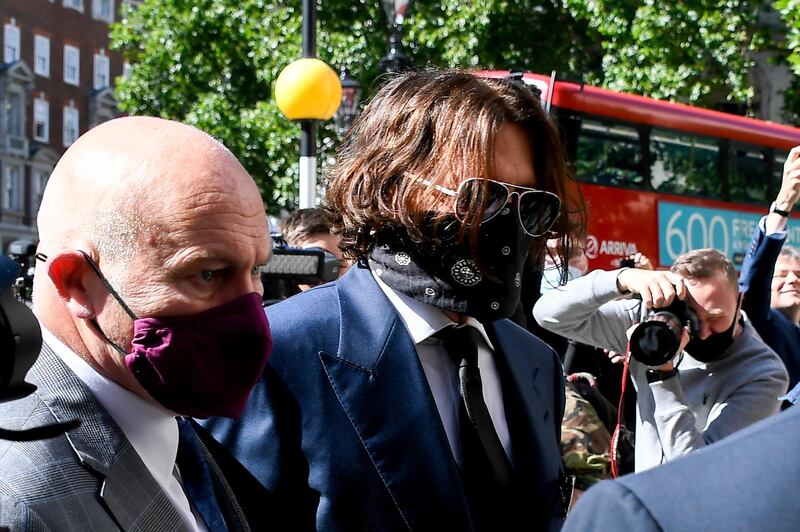 Actor Johnny Depp arrives at the Royal Court of Justice, in London. Johnny Depp is suing a UK tabloid newspaper for libel. AP Photo