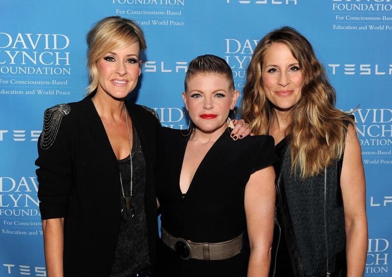 (FILES) In this file photo taken on February 27, 2014 (L-R) musicians Martie Maguire, Natalie Maines and Emily Robison of the Dixie Chicks arrive at the David Lynch Foundation Gala Honoring Rick Rubin at the Beverly Wilshire Hotel on in Beverly Hills, California.  The country trio Dixie Chicks are now simply The Chicks, dropping a nickname for the Confederate-era South from their band name. The stealthy switch saw the group amend their social media usernames and release a new song and accompanying video "March March" on June 25, 2020. / AFP / GETTY IMAGES NORTH AMERICA / KEVIN WINTER
