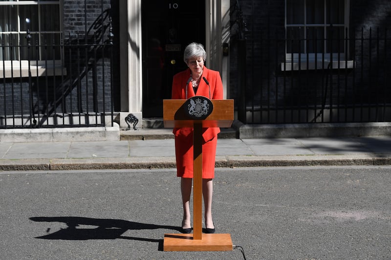 Theresa May announces her resignation in May 2019 in Downing Street, behind a slimline lectern. Getty Images