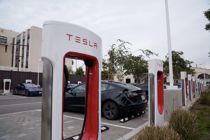 Tesla vehicles charge at a station in Santa Monica, California. Tesla cut prices across its line-up in the US and major European markets in the car maker's latest effort to stoke demand after several quarters of disappointing deliveries. Bloomberg