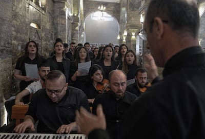A choir chants during mass at the Syriac Catholic Church of Mar Tuma in Mosul last April. AFP