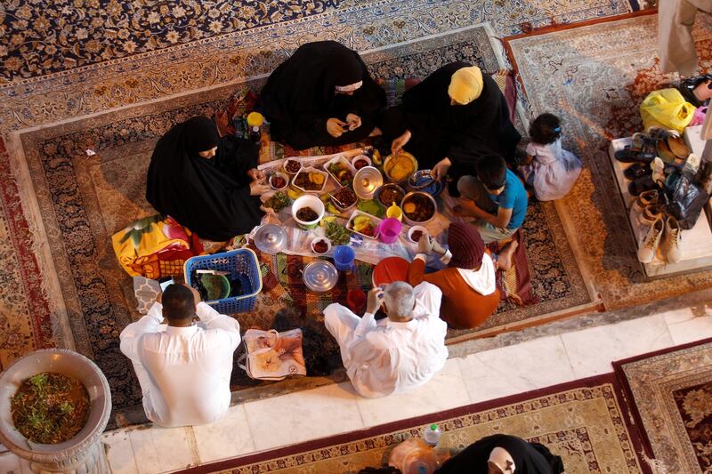An Iraqi family gather for iftar after a day's fast during the month of Ramadan in Hilla, Iraq. Reuters