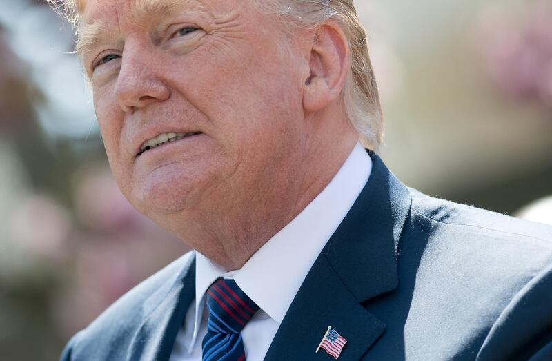 (FILES) In this file photo taken on April 12, 2018 US President Donald Trump speaks about tax cuts during an event with American workers in the Rose Garden of the White House in Washington, DC.
Several Democratic lawmakers upbraided President Donald Trump on April 13, 2018 for using social media to telegraph potential attacks against Syria, warning that his "reckless" and "taunting" language endangers American troops. Nine members of the House of Representatives, all of them US military veterans, urged the president to immediately halt his provocations, which included tweets this week after an apparent chemical weapons attack in the Syrian town of Douma where the British government estimates up to 75 people were killed.
 / AFP PHOTO / SAUL LOEB