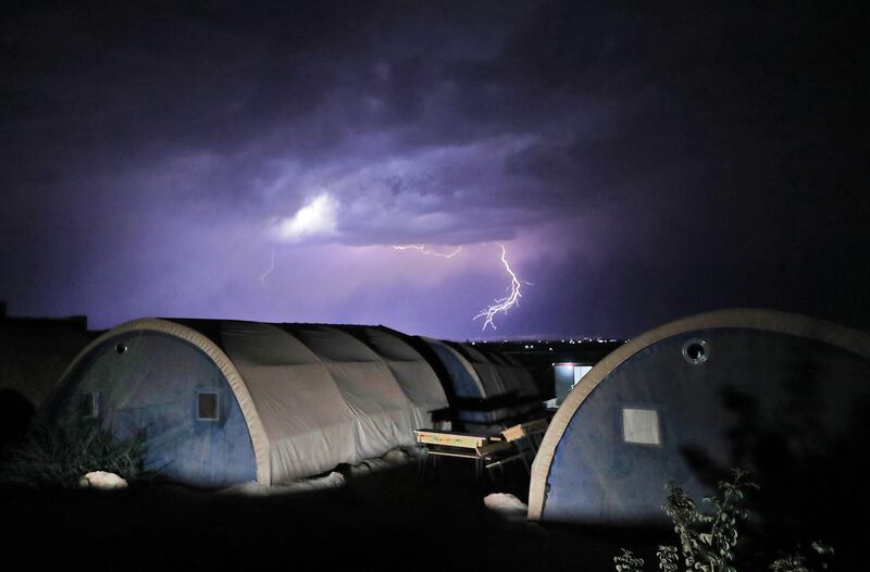 Lightning strikes during a thunderstorm in Al Yaman camp for people internally-displaced by conflict north of Syria's rebel-held north-western city of Idlib. AFP