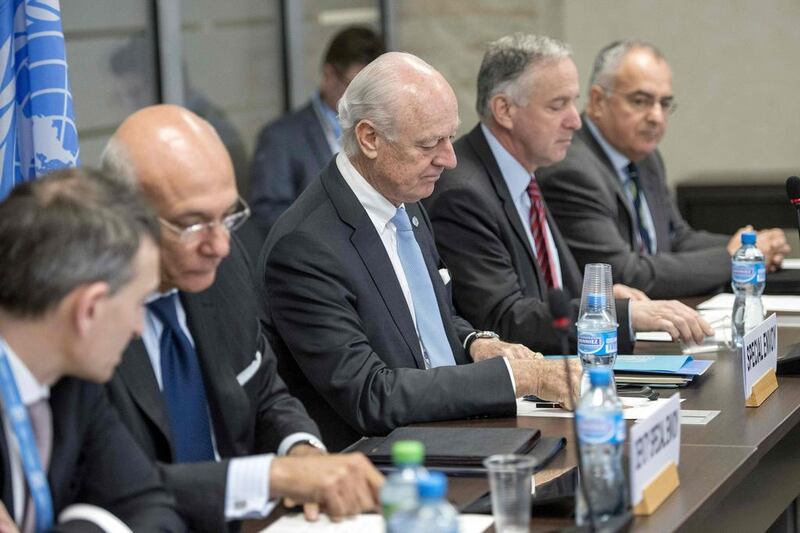 UN special envoy for Syria Staffan de Mistura, centre, during negotiations between the Syria's regime-tolerated opposition and the UN, at the European headquarters of the United Nations in Geneva, on April 27, 2016. Russia has asked the UN to blacklist a major rebel group that is playing a key role in peace talks to end the Syrian civil war, its ambassador to the UN said. Martial Trezzini/AFP