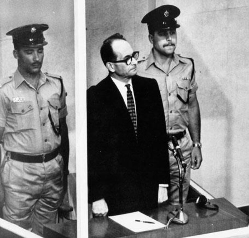 Adolf Eichmann at his trial in a bullet-proof booth.