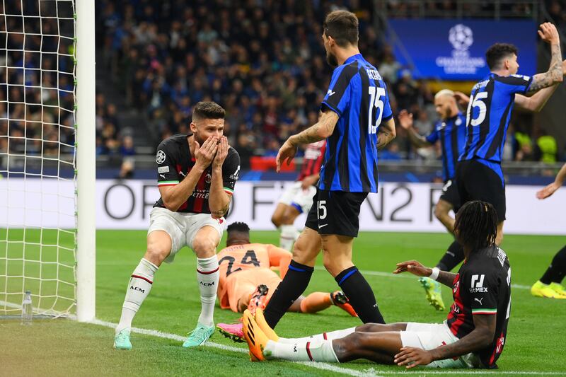 Olivier Giroud of AC Milan after and Rafael Leao, right, misses a chance. Getty Images