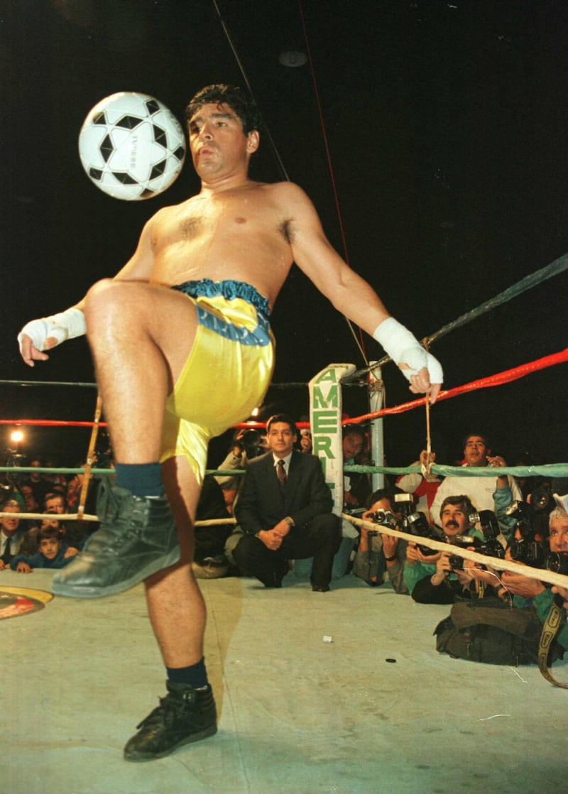3 Apr 1996:  Soccer star Diego Maradona juggles a soccer ball in the ring at the end of a charity boxing match against Falucho Lacier, former WBA Flyweight world champion at the General Paz Junior's Club in Cordoba, Argentina. Getty