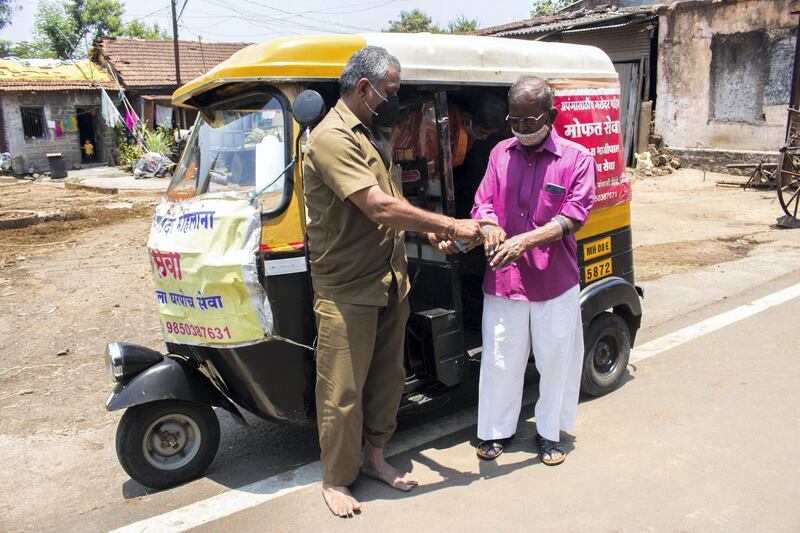 First, he sanitises the hands of the passengers and only then allows them to sit. Sanket Jain for The National