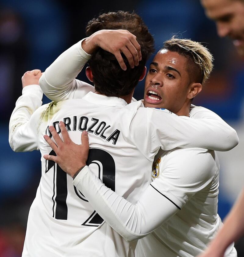 Mariano of Real Madrid, right, celebrates with Alvaro Odriozola. Getty