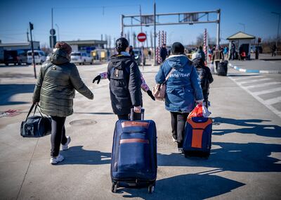 Refugees from Ukraine head for Moldova at the border crossing in Palanca. Getty Images