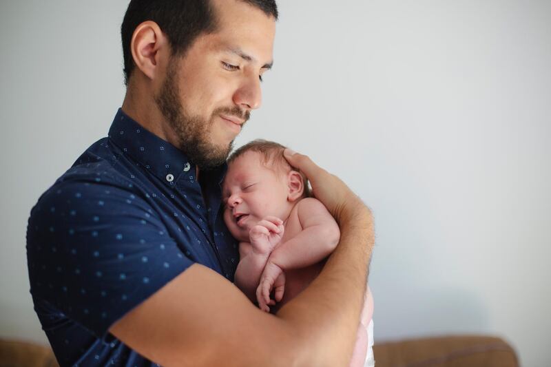 newborn, baby, family, parent, inter racial family. Getty Images