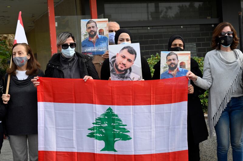 Anti-government protesters and families of Beirut blast victims rally in support of the Public Prosecutor, judge Tarek Bitar, in Beirut. EPA