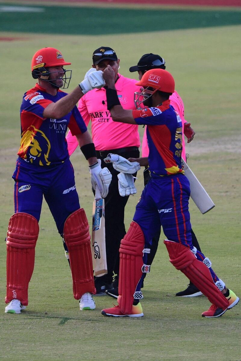 Karachi Kings' Babar Azam and Daniel Christian celebrates after winning their Pakistan Super League match against Peshawar Zalmi.