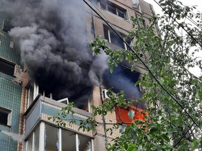 A fire at the nine-storey residential building partially destroyed by a Russian strike in Kryvyi Rih. AFP