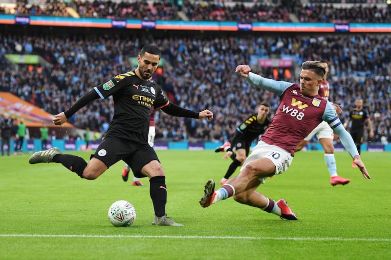 Jack Grealish lunges in to block a cross from Ilkay Gundogan during the League Cup final. Getty Images