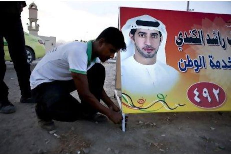FNC campaign posters like this one in Fujairah are steadily popping up around the Emirates. Silvia Razgova / The National
