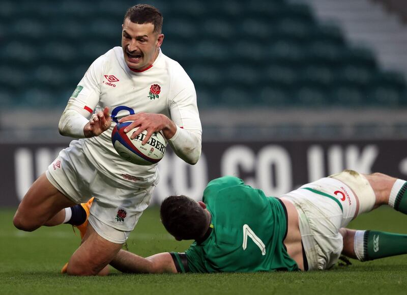 England's wing Jonny May (L) scores their second try during the Autumn Nations Cup international rugby union match between England and Ireland at Twickenham in London, on November 21, 2020. / AFP / Adrian DENNIS
