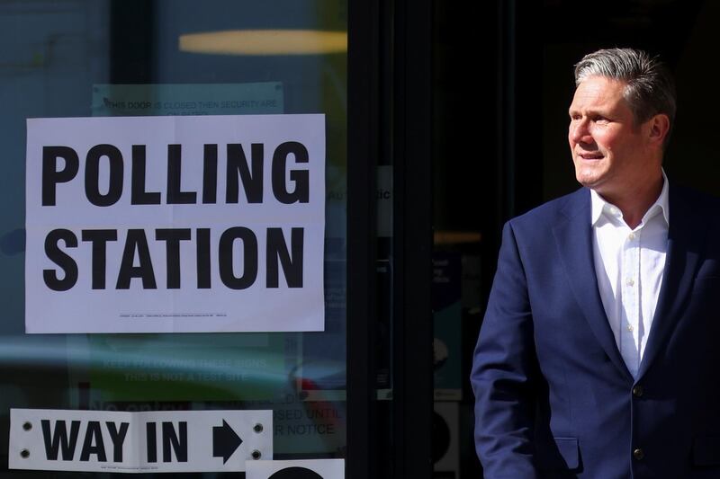 Britain's Labour Party leader Keir Starmer leaves a polling station after casting a vote in London. Reuters