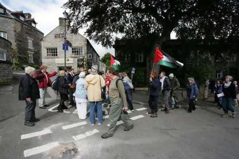 Hikers gather to participate in a walk for the Palestine Solidarity Campaign in Derbyshire, England.