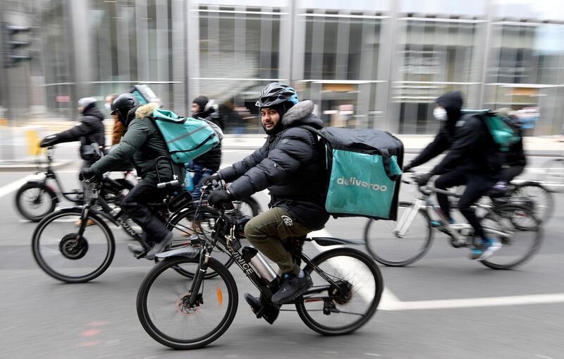 FILE PHOTO: Deliveroo riders demonstrate to push for improved working conditions, in London, Britain, April 7, 2021. REUTERS/Toby Melville/File Photo