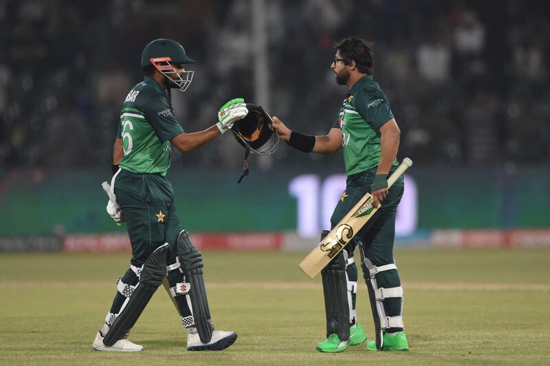 Pakistan's Imam-ul-Haq, right, celebrates with teammate Babar Azam after scoring a century. AFP