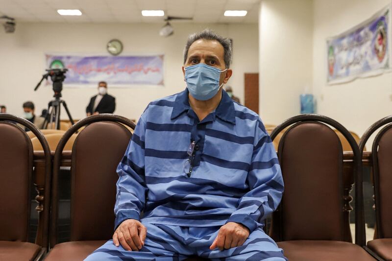 Jamshid Sharmahd attends the first hearing of his trial in Tehran in February. Mizan via AFP