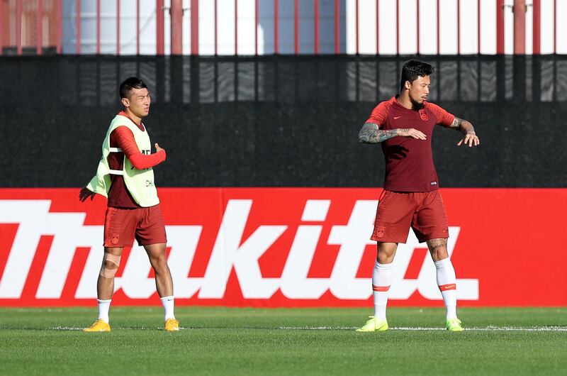 Abu Dhabi, United Arab Emirates - January 03, 2019: Yu Han Chao (L) and Zhang Lin Peng (R) of China train before the start of the Asian Cup 2019. Thursday, January 3rd, 2019 in Al Wahda Academy, Abu Dhabi. Chris Whiteoak/The National